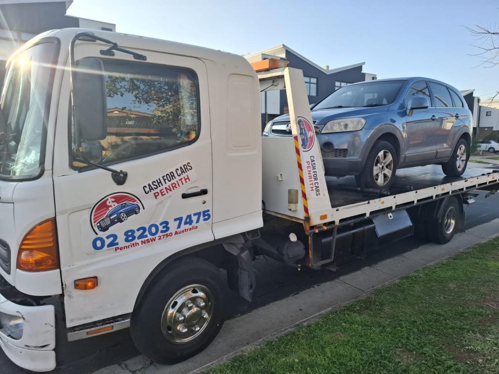 Blue Holden Captiva SUV on the Cash For Cars Penrith tilt-tray truck