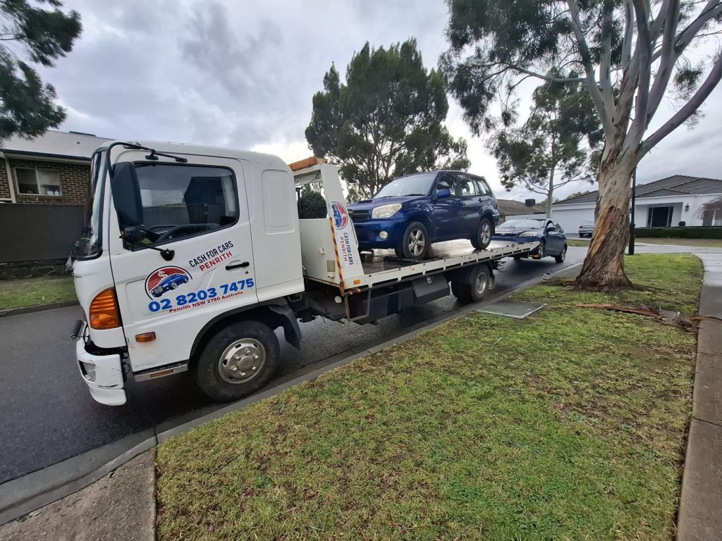 Blue Toyota RAV4 SUV on the Cash For Cars Penrith tilt-tray truck