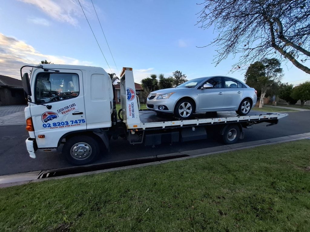 Silver Holden Cruze sedan on the Cash For Cars Penrith tilt-tray truck