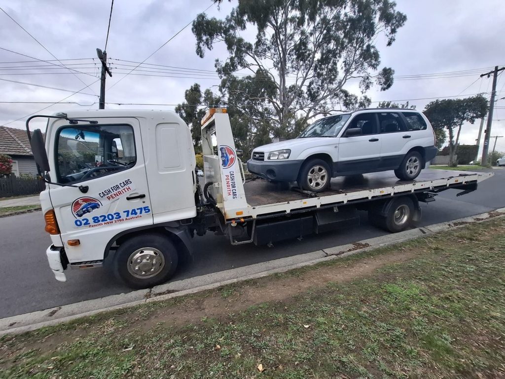 White Subaru Forester on the Cash For Cars Penrith tilt-tray truck